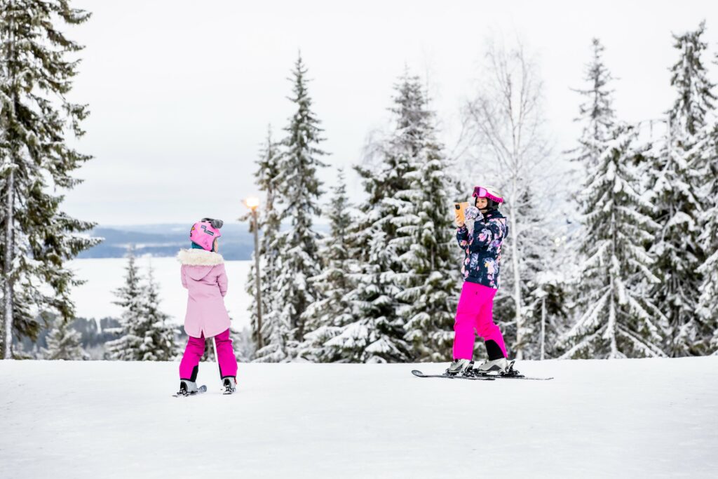 A woman and a girl skiing