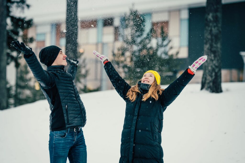 A young couple enjoying the snow.